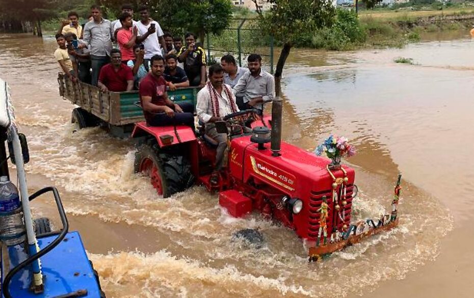 Indians drive tractors to work because of flooding